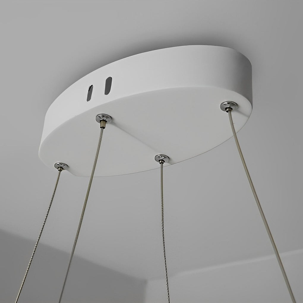1. "HARTLEY WAVING SILHOUETTE LED CHANDELIER"  
   - Features fluid, undulating lines that create a dynamic visual effect with stepless dimming functionality.

2. "WINCHESTER FLUID FORM LED LIGHTING"  
   - Showcases a minimalist design with gracefully cu