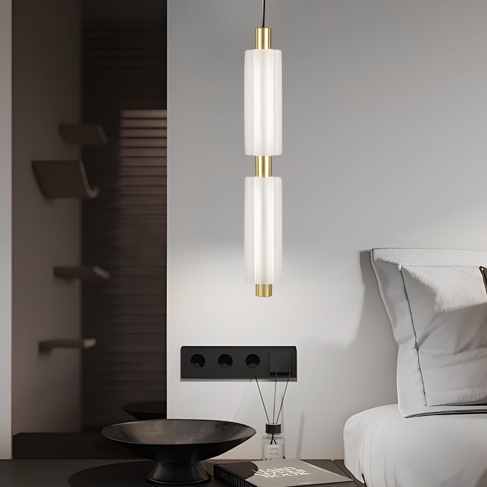 1. **WINSLOW ACRYLIC TRIO PENDANT LAMP**: A striking modern luminaire featuring three cylindrical shades in a sophisticated gold finish, perfect for illuminating dining areas or living spaces with a contemporary flair.

2. **CAMPBELL SINGLE CYLINDER HANGI