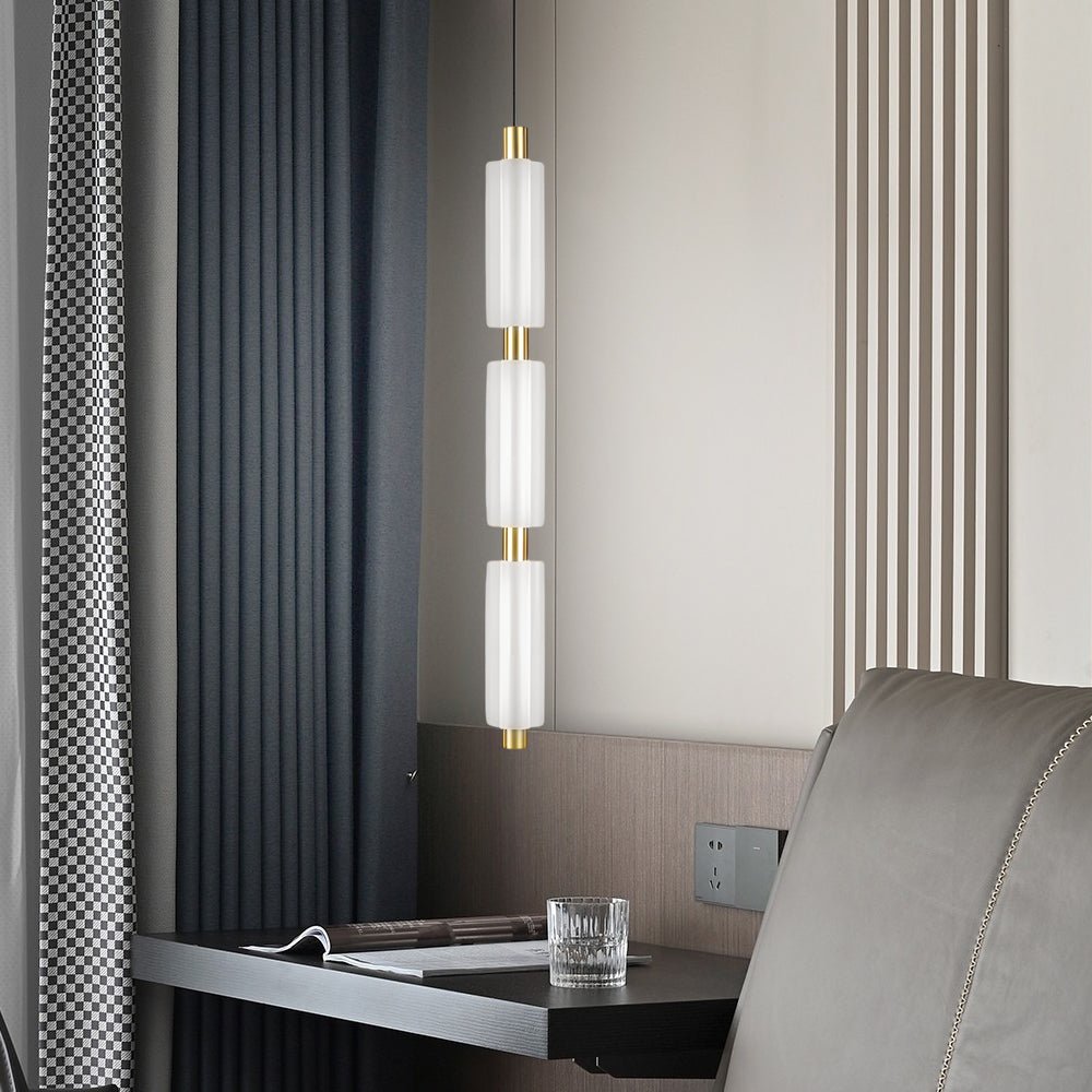 1. **WINSLOW ACRYLIC TRIO PENDANT LAMP**: A striking modern luminaire featuring three cylindrical shades in a sophisticated gold finish, perfect for illuminating dining areas or living spaces with a contemporary flair.

2. **CAMPBELL SINGLE CYLINDER HANGI