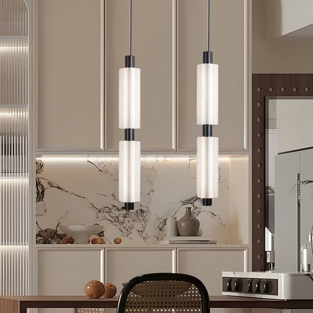 1. **WINSLOW ACRYLIC TRIO PENDANT LAMP**: A striking modern luminaire featuring three cylindrical shades in a sophisticated gold finish, perfect for illuminating dining areas or living spaces with a contemporary flair.

2. **CAMPBELL SINGLE CYLINDER HANGI