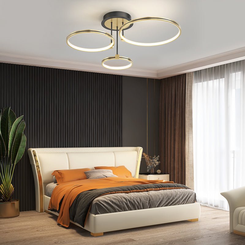 1. **WINSLOW TRIO RING DIMMER CEILING LIGHT** - Featuring three interlocking rings with a sophisticated gold finish, this modern ceiling fixture offers adjustable brightness and a touch of leather for added texture.

2. **TAVISTOCK QUINTET RING DIMMABLE L