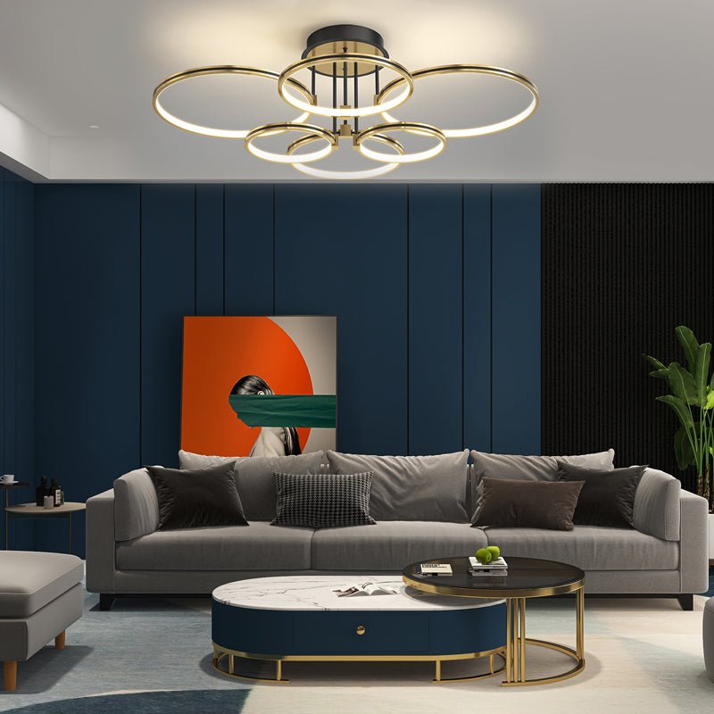1. **WINSLOW TRIO RING DIMMER CEILING LIGHT** - Featuring three interlocking rings with a sophisticated gold finish, this modern ceiling fixture offers adjustable brightness and a touch of leather for added texture.

2. **TAVISTOCK QUINTET RING DIMMABLE L