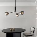 WINTHROP DIMPLED LAVA GLASS MULTI-LIGHT CHANDELIER WITH BLACK METALLIC ARMS