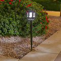 1. **WINSLOW NIGHTSCAPE SOLAR PATHWAY LANTERNS** - A set of four sleek, modern lanterns designed to illuminate your outdoor walkways with solar-powered efficiency.

2. **THORNTON BLACKSTONE GARDEN ILLUMINATORS** - This collection of four striking outdoor