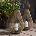 1. **HATHERLEIGH RATTAN WEAVE OUTDOOR LANTERN**  
   A handcrafted rattan lantern featuring a waterproof design, perfect for illuminating your outdoor spaces with a touch of modern charm.

2. **PENROSE IRON & RATTAN GARDEN LIGHT**  
   This unique outdoor