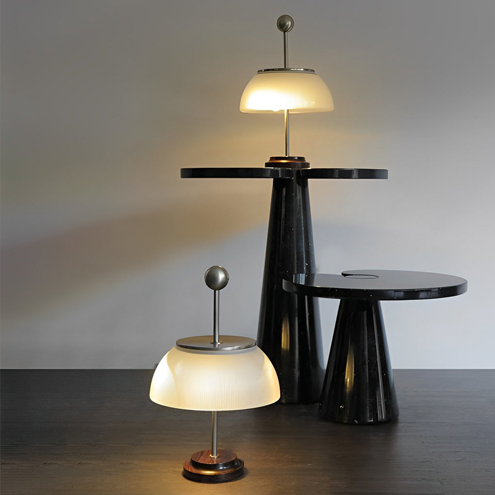 CAVENDISH RIBBED GLASS BOWL LAMP WITH METALLIC ITALIAN TRIM"  
2. "WINSLOW METAL AND RIBBED GLASS TABLE LAMP WITH ITALIAN INFLUENCE