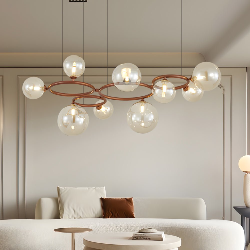 WILLOUGHBY SPHERE 5-BULB DIMMABLE CHANDELIER"  
2. "FENWICK TRIO-LEVEL GLASS ORB LIGHTING FIXTURE"  
3. "CHARLESTON 9-BULB CONTEMPORARY GLASS PENDANT"  
4. "HASTINGS CIRCULAR 7-LIGHT GLASS CHANDELIER"  
5. "BRIDGEMAN ROUNDEL DIMMABLE CHANDELIER WITH GLASS