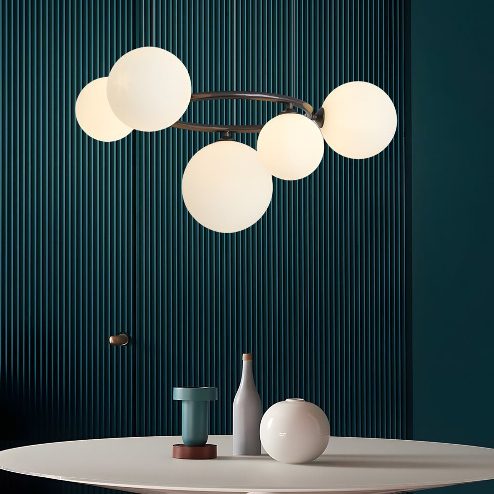 WILLOUGHBY SPHERE 5-BULB DIMMABLE CHANDELIER"  
2. "FENWICK TRIO-LEVEL GLASS ORB LIGHTING FIXTURE"  
3. "CHARLESTON 9-BULB CONTEMPORARY GLASS PENDANT"  
4. "HASTINGS CIRCULAR 7-LIGHT GLASS CHANDELIER"  
5. "BRIDGEMAN ROUNDEL DIMMABLE CHANDELIER WITH GLASS