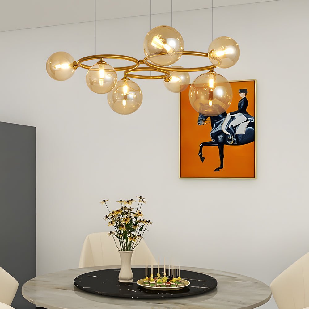 WILLOUGHBY SPHERE 5-BULB DIMMABLE CHANDELIER"  
2. "FENWICK TRIO-LEVEL GLASS ORB LIGHTING FIXTURE"  
3. "CHARLESTON 9-BULB CONTEMPORARY GLASS PENDANT"  
4. "HASTINGS CIRCULAR 7-LIGHT GLASS CHANDELIER"  
5. "BRIDGEMAN ROUNDEL DIMMABLE CHANDELIER WITH GLASS