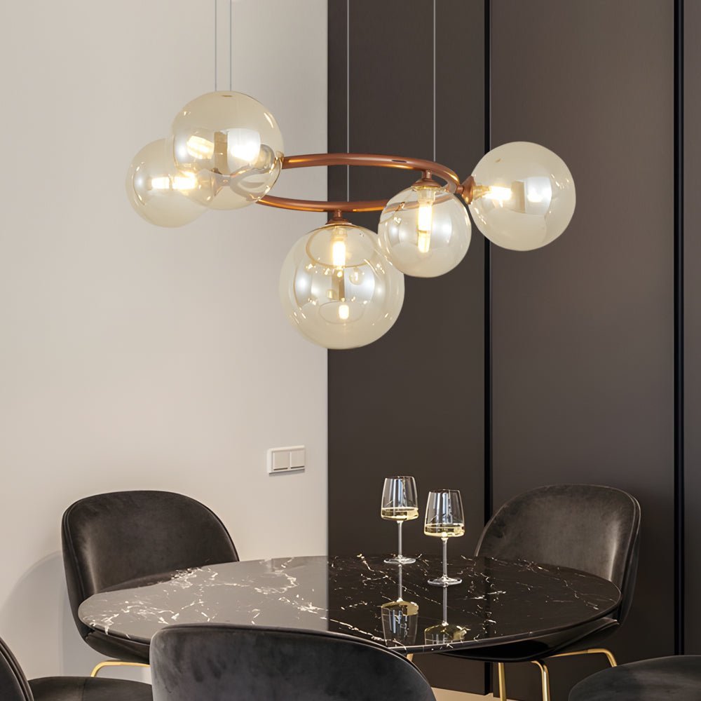 WILLOUGHBY SPHERE 5-BULB DIMMABLE CHANDELIER"  
2. "FENWICK TRIO-LEVEL GLASS ORB LIGHTING FIXTURE"  
3. "CHARLESTON 9-BULB CONTEMPORARY GLASS PENDANT"  
4. "HASTINGS CIRCULAR 7-LIGHT GLASS CHANDELIER"  
5. "BRIDGEMAN ROUNDEL DIMMABLE CHANDELIER WITH GLASS