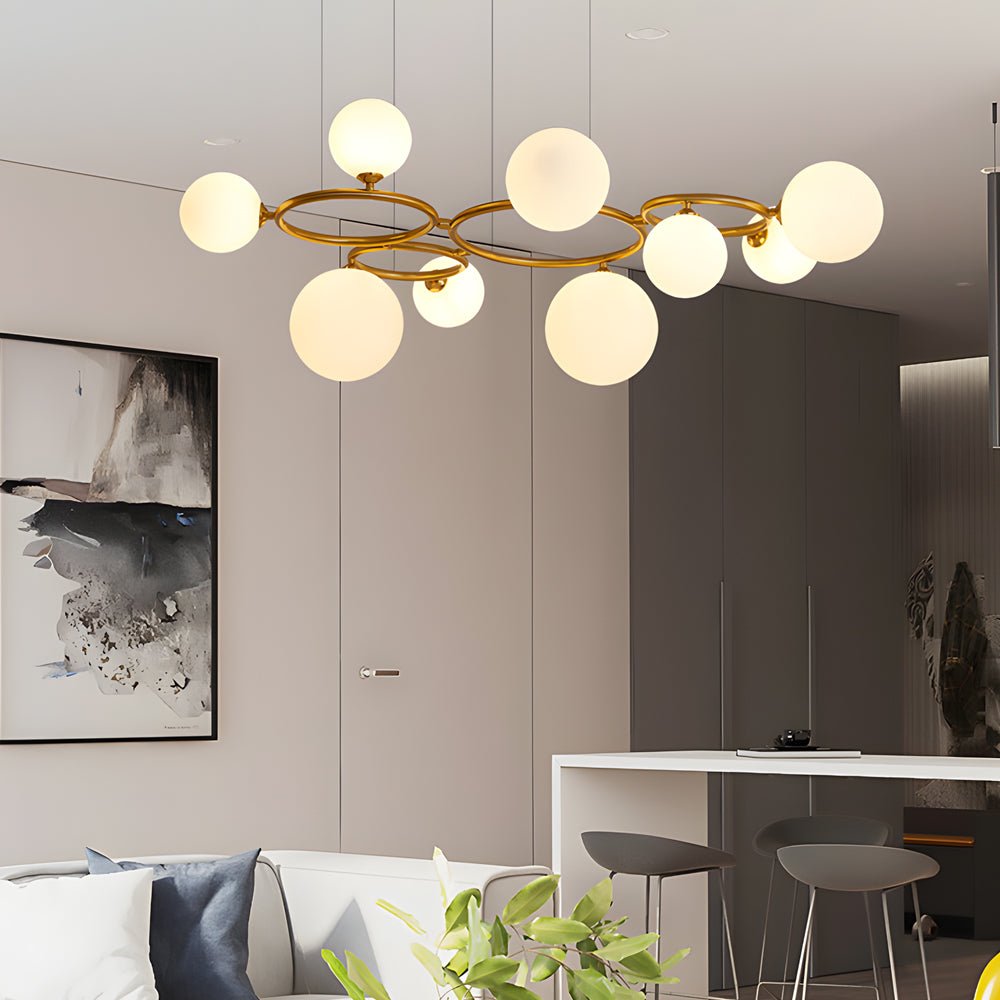 WILLOUGHBY SPHERE 5-BULB DIMMABLE CHANDELIER"  
2. "FENWICK TRIO-LEVEL GLASS ORB LIGHTING FIXTURE"  
3. "CHARLESTON 9-BULB CONTEMPORARY GLASS PENDANT"  
4. "HASTINGS CIRCULAR 7-LIGHT GLASS CHANDELIER"  
5. "BRIDGEMAN ROUNDEL DIMMABLE CHANDELIER WITH GLASS