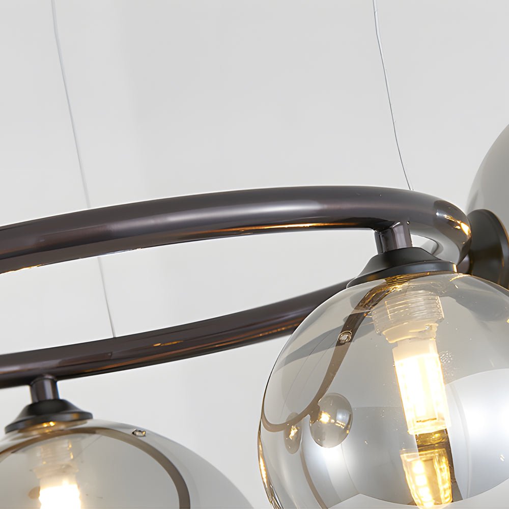 WILLOUGHBY SPHERE 5-BULB DIMMABLE CHANDELIER"  
2. "FENWICK TRIO-LEVEL GLASS ORB LIGHTING FIXTURE"  
3. "CHARLESTON 9-BULB CONTEMPORARY GLASS PENDANT"  
4. "HASTINGS CIRCULAR 7-LIGHT GLASS CHANDELIER"  
5. "BRIDGEMAN ROUNDEL DIMMABLE CHANDELIER WITH GLASS