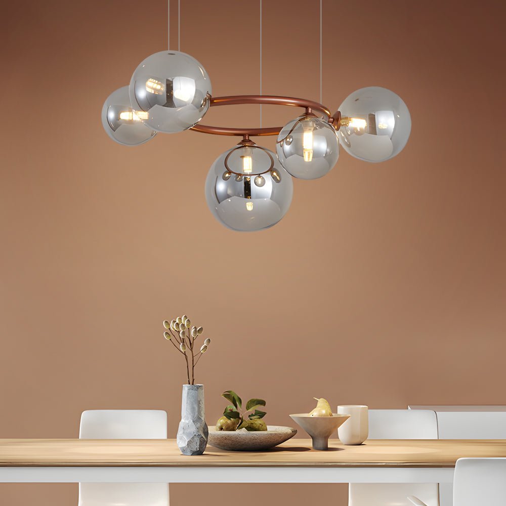 WILLOUGHBY SPHERE 5-BULB DIMMABLE CHANDELIER"  
2. "FENWICK TRIO-LEVEL GLASS ORB LIGHTING FIXTURE"  
3. "CHARLESTON 9-BULB CONTEMPORARY GLASS PENDANT"  
4. "HASTINGS CIRCULAR 7-LIGHT GLASS CHANDELIER"  
5. "BRIDGEMAN ROUNDEL DIMMABLE CHANDELIER WITH GLASS