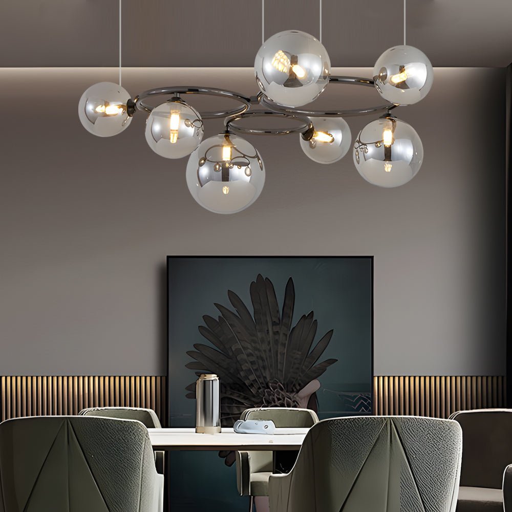 WILLOUGHBY SPHERE 5-BULB DIMMABLE CHANDELIER"  
2. "FENWICK TRIO-LEVEL GLASS ORB LIGHTING FIXTURE"  
3. "CHARLESTON 9-BULB CONTEMPORARY GLASS PENDANT"  
4. "HASTINGS CIRCULAR 7-LIGHT GLASS CHANDELIER"  
5. "BRIDGEMAN ROUNDEL DIMMABLE CHANDELIER WITH GLASS