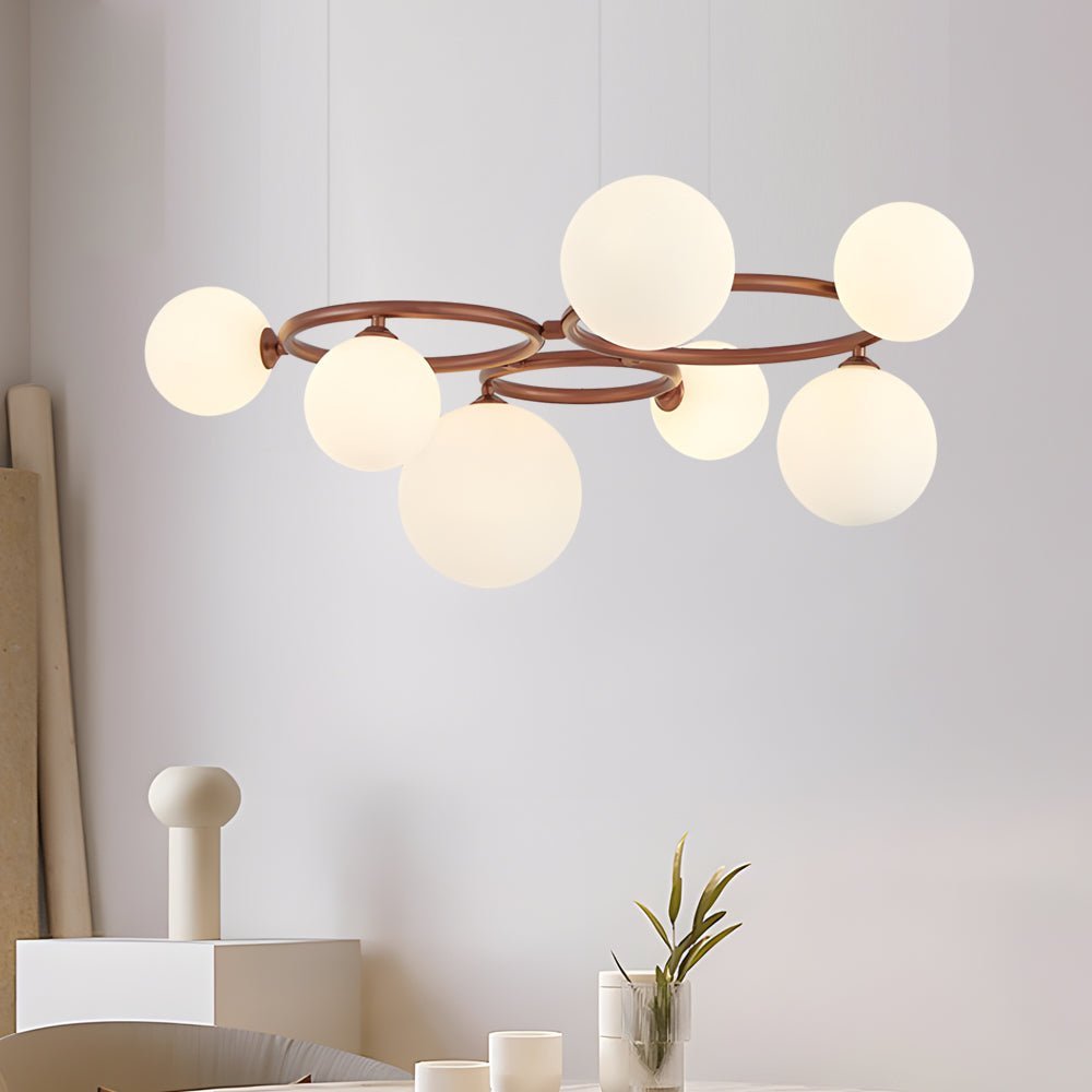 WILLOUGHBY SPHERE 5-BULB DIMMABLE CHANDELIER"  
2. "FENWICK TRIO-LEVEL GLASS ORB LIGHTING FIXTURE"  
3. "CHARLESTON 9-BULB CONTEMPORARY GLASS PENDANT"  
4. "HASTINGS CIRCULAR 7-LIGHT GLASS CHANDELIER"  
5. "BRIDGEMAN ROUNDEL DIMMABLE CHANDELIER WITH GLASS