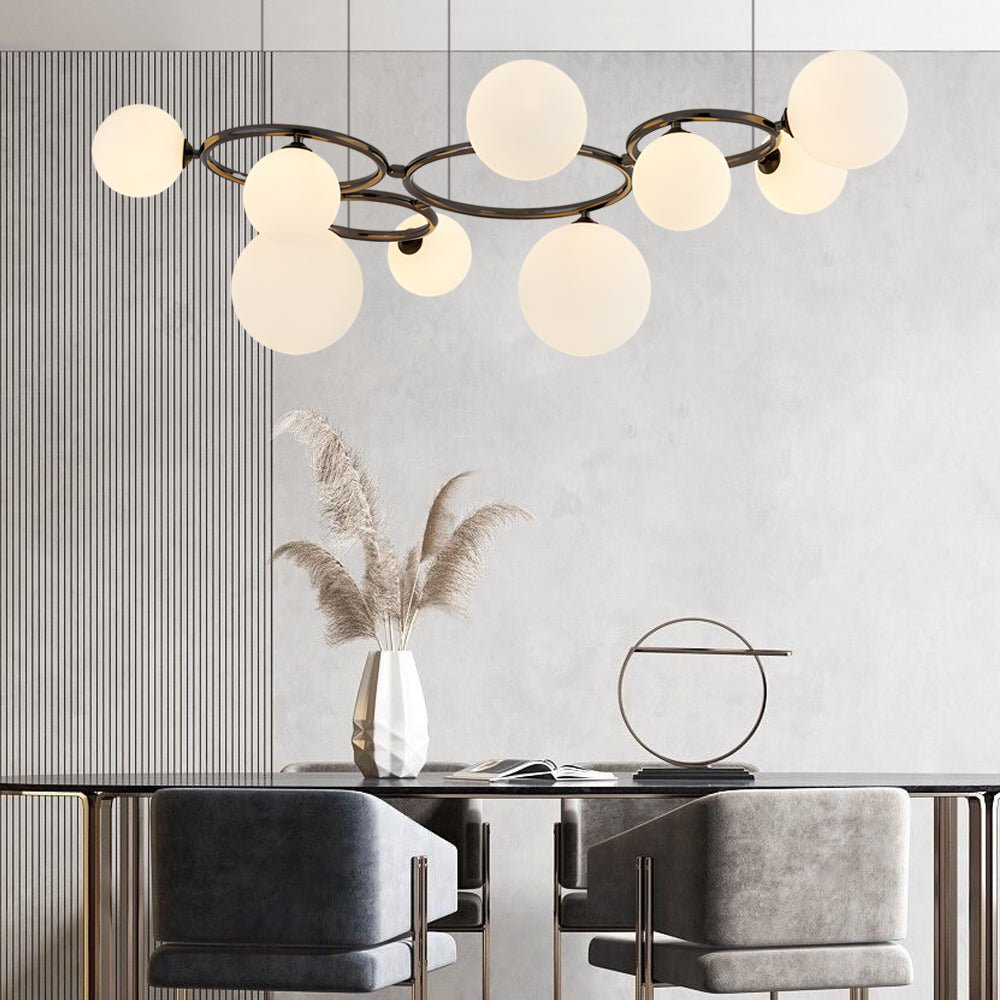 WILLOUGHBY SPHERE 5-BULB DIMMABLE CHANDELIER"  
2. "FENWICK TRIO-LEVEL GLASS ORB LIGHTING FIXTURE"  
3. "CHARLESTON 9-BULB CONTEMPORARY GLASS PENDANT"  
4. "HASTINGS CIRCULAR 7-LIGHT GLASS CHANDELIER"  
5. "BRIDGEMAN ROUNDEL DIMMABLE CHANDELIER WITH GLASS
