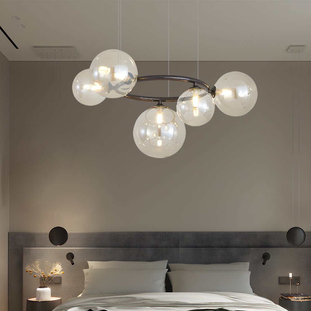 WILLOUGHBY SPHERE 5-BULB DIMMABLE CHANDELIER"  
2. "FENWICK TRIO-LEVEL GLASS ORB LIGHTING FIXTURE"  
3. "CHARLESTON 9-BULB CONTEMPORARY GLASS PENDANT"  
4. "HASTINGS CIRCULAR 7-LIGHT GLASS CHANDELIER"  
5. "BRIDGEMAN ROUNDEL DIMMABLE CHANDELIER WITH GLASS