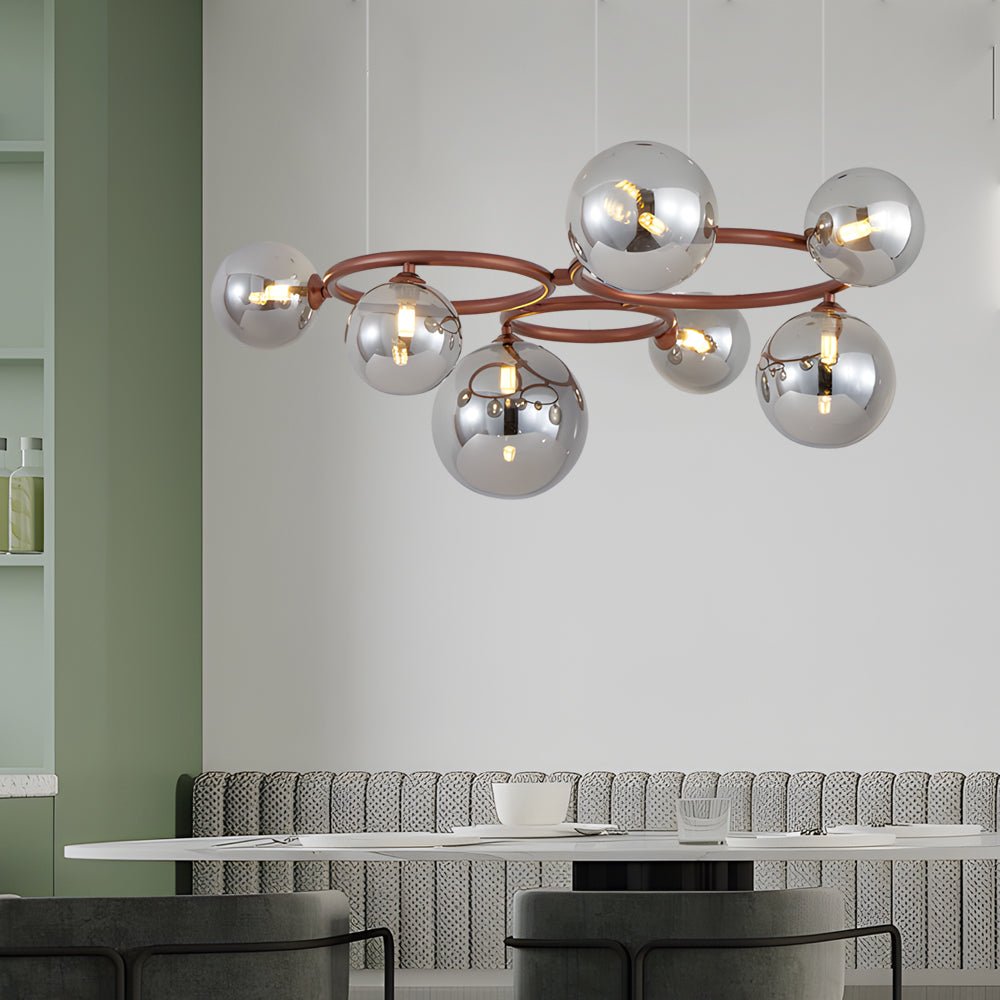 WILLOUGHBY SPHERE 5-BULB DIMMABLE CHANDELIER"  
2. "FENWICK TRIO-LEVEL GLASS ORB LIGHTING FIXTURE"  
3. "CHARLESTON 9-BULB CONTEMPORARY GLASS PENDANT"  
4. "HASTINGS CIRCULAR 7-LIGHT GLASS CHANDELIER"  
5. "BRIDGEMAN ROUNDEL DIMMABLE CHANDELIER WITH GLASS