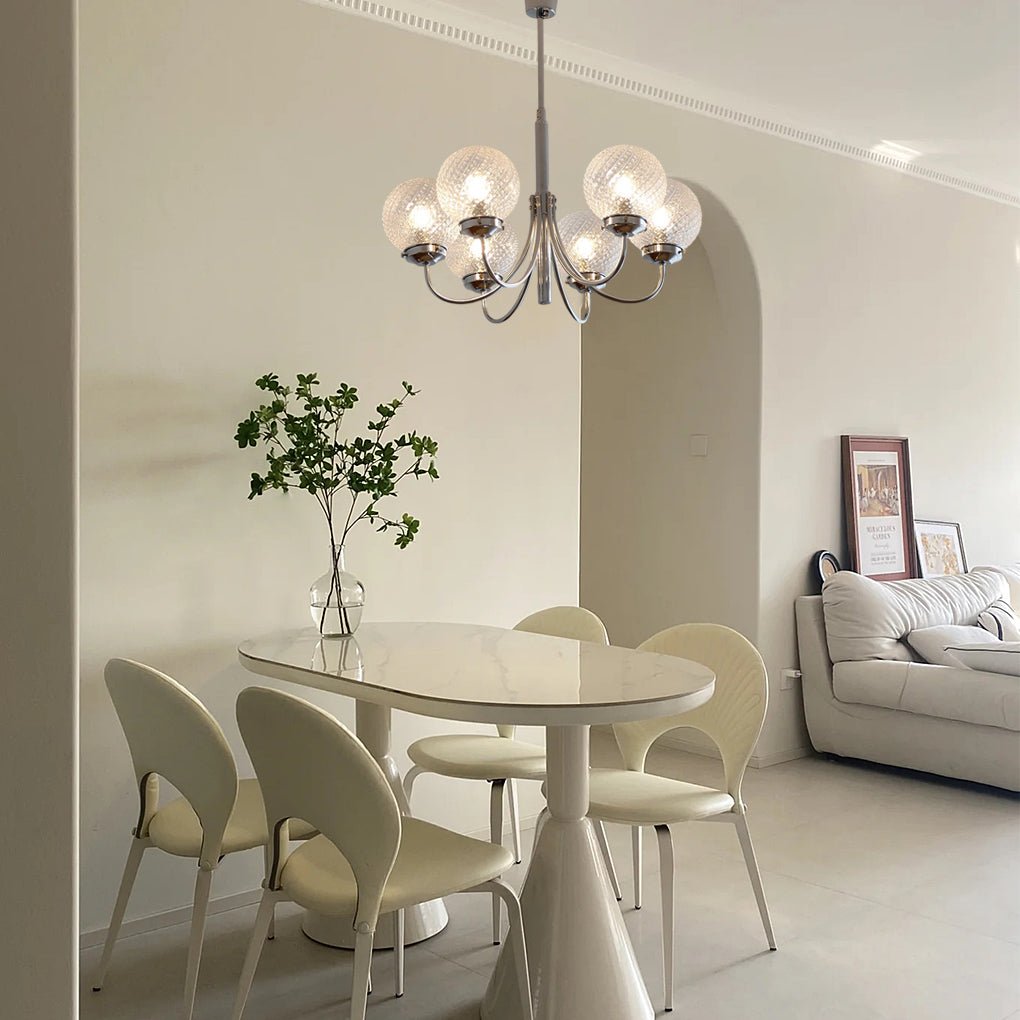 1. "WINSLOW COSMIC ORB CHANDELIER"  
   - A striking six-light fixture featuring minimalist glass orbs that evoke a celestial theme, perfect for contemporary spaces.

2. "HARTLEY ASTRAL GLASS SPHERE LIGHTING"  
   - This postmodern chandelier showcases si