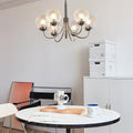 1. "WINSLOW COSMIC ORB CHANDELIER"  
   - A striking six-light fixture featuring minimalist glass orbs that evoke a celestial theme, perfect for contemporary spaces.

2. "HARTLEY ASTRAL GLASS SPHERE LIGHTING"  
   - This postmodern chandelier showcases si