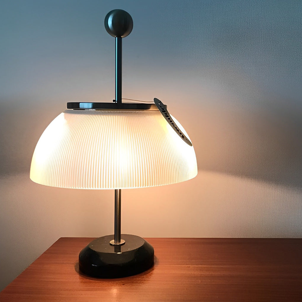 CAVENDISH RIBBED GLASS BOWL LAMP WITH METALLIC ITALIAN TRIM"  
2. "WINSLOW METAL AND RIBBED GLASS TABLE LAMP WITH ITALIAN INFLUENCE