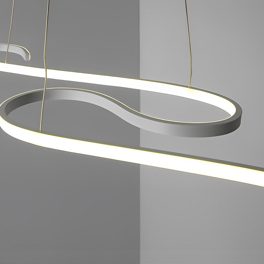 1. "HARTLEY WAVING SILHOUETTE LED CHANDELIER"  
   - Features fluid, undulating lines that create a dynamic visual effect with stepless dimming functionality.

2. "WINCHESTER FLUID FORM LED LIGHTING"  
   - Showcases a minimalist design with gracefully cu