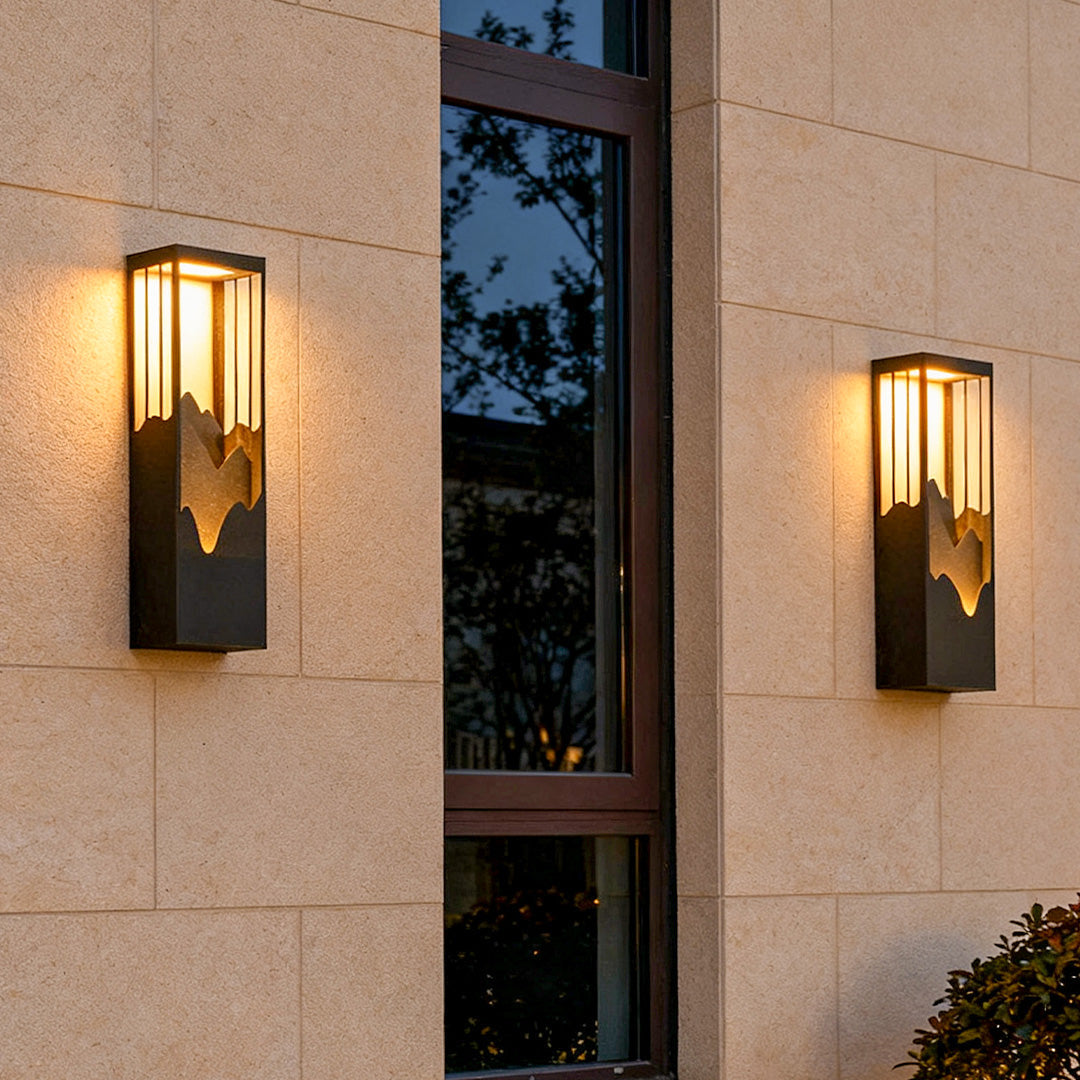 **HARTFIELD SOLAR-POWERED MOUNTAIN VIEW WALL LANTERN**  
Illuminate your outdoor spaces with this waterproof wall lamp featuring a stunning mountain scenery design. Equipped with up and down LED lighting, it enhances your porch or patio with a warm glow w