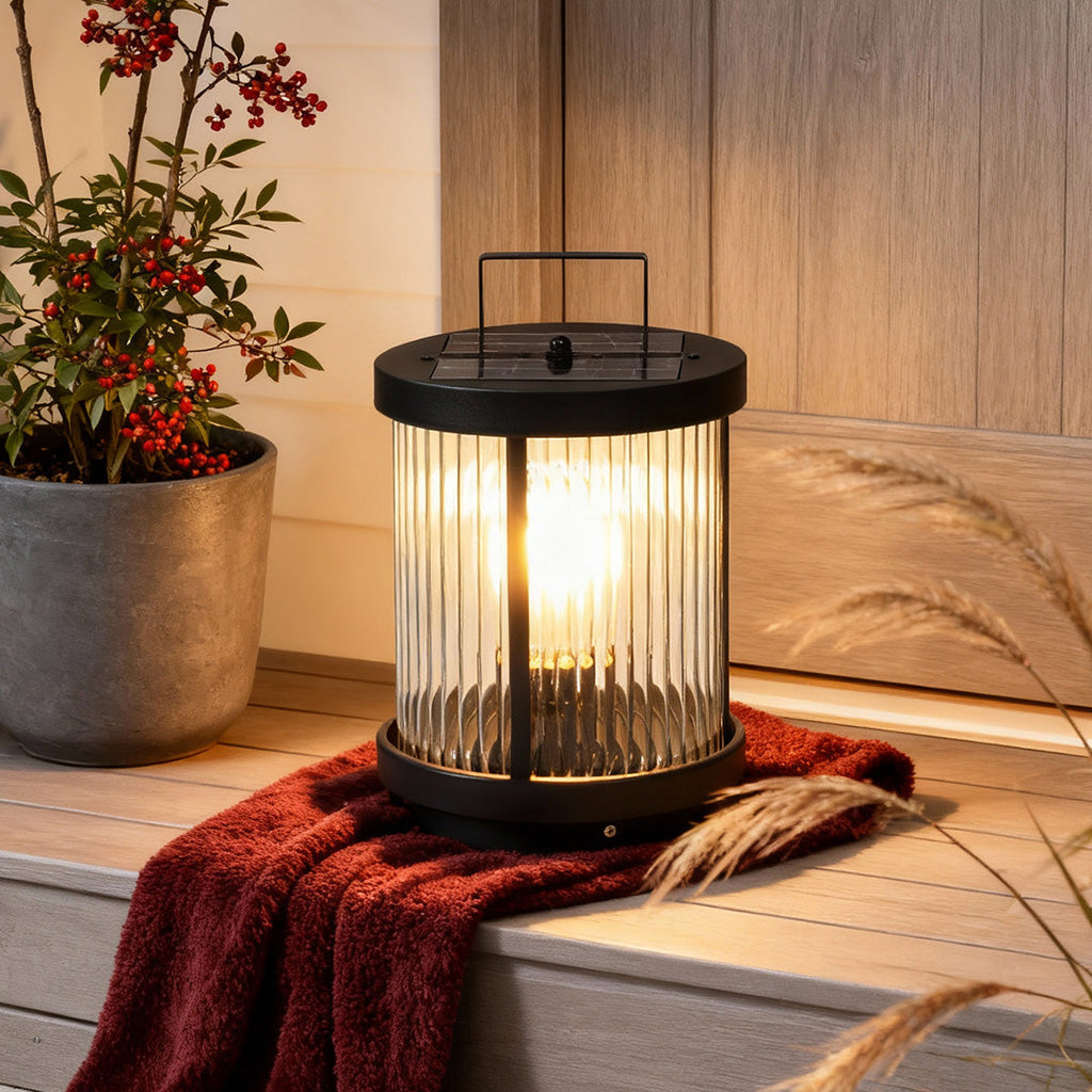1. **WILLOUGHBY STRIPE SOLAR GLOBE LANTERN** - A waterproof, cylindrical lantern featuring a charming striped design, perfect for illuminating outdoor spaces with solar-powered efficiency.

2. **HASTINGS RIBBED SOLAR CANDLE LANTERN** - This portable outdo