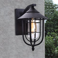 WINTERBOURNE RUSTIC IRON AND GLASS MOTION-ACTIVATED OUTDOOR WALL LANTERN