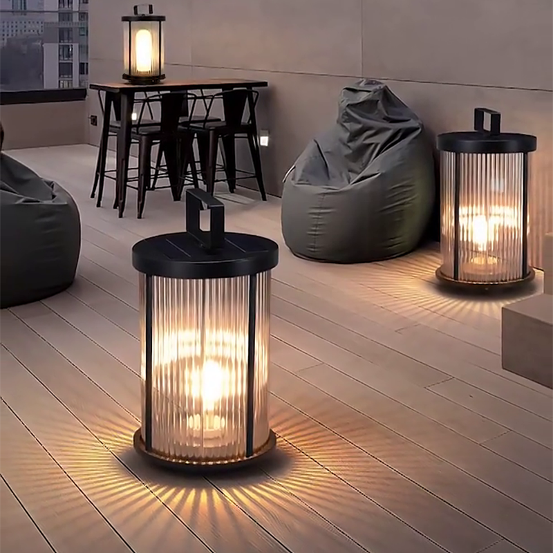 1. **WILLOUGHBY STRIPE SOLAR GLOBE LANTERN** - A waterproof, cylindrical lantern featuring a charming striped design, perfect for illuminating outdoor spaces with solar-powered efficiency.

2. **HASTINGS RIBBED SOLAR CANDLE LANTERN** - This portable outdo
