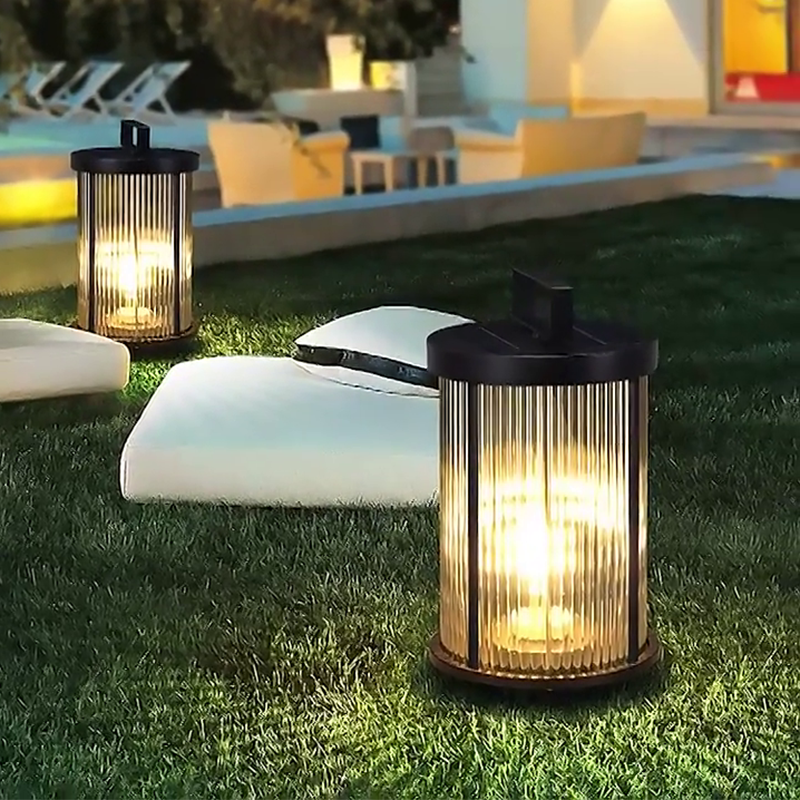 1. **WILLOUGHBY STRIPE SOLAR GLOBE LANTERN** - A waterproof, cylindrical lantern featuring a charming striped design, perfect for illuminating outdoor spaces with solar-powered efficiency.

2. **HASTINGS RIBBED SOLAR CANDLE LANTERN** - This portable outdo