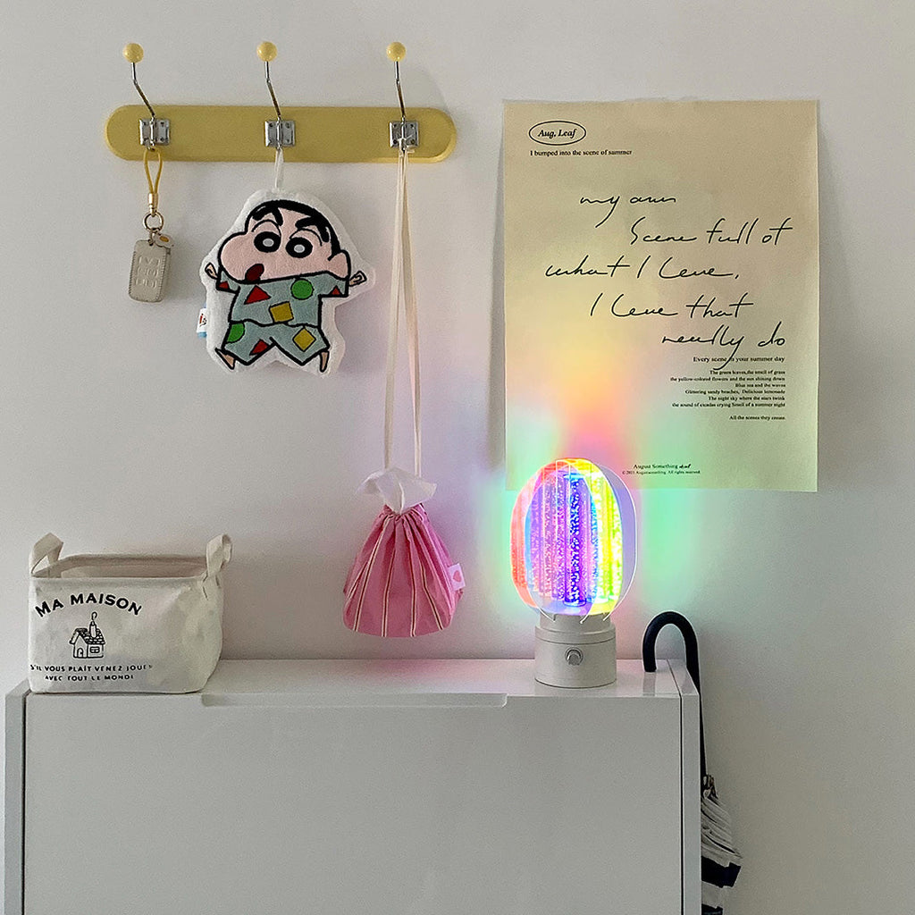 1. "VIVIENNE RAINBOW METAL TABLE LAMP"  
   A vibrant blend of colors and artistic design, this aluminum table lamp radiates warmth and creativity with its unique LED illumination.

2. "HAMPSTEAD ARTISANAL RAINBOW LAMP"  
   A striking fusion of color and