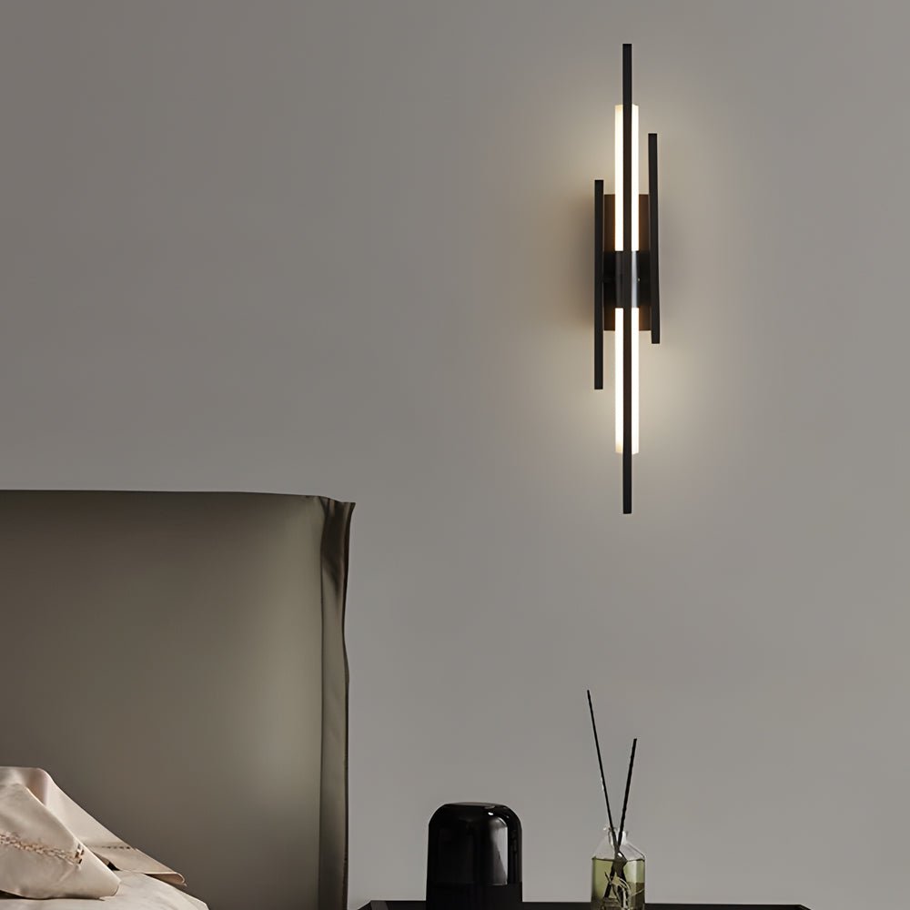 1. **WILLOUGHBY TRIO-TONE ACRYLIC WALL SCONCE**  
   A striking fusion of black, gold, and copper finishes, this modern LED wall sconce adds a contemporary flair to any space.

2. **CAVENDISH MODERNIST IRON WALL LANTERN**  
   Crafted from durable iron wi