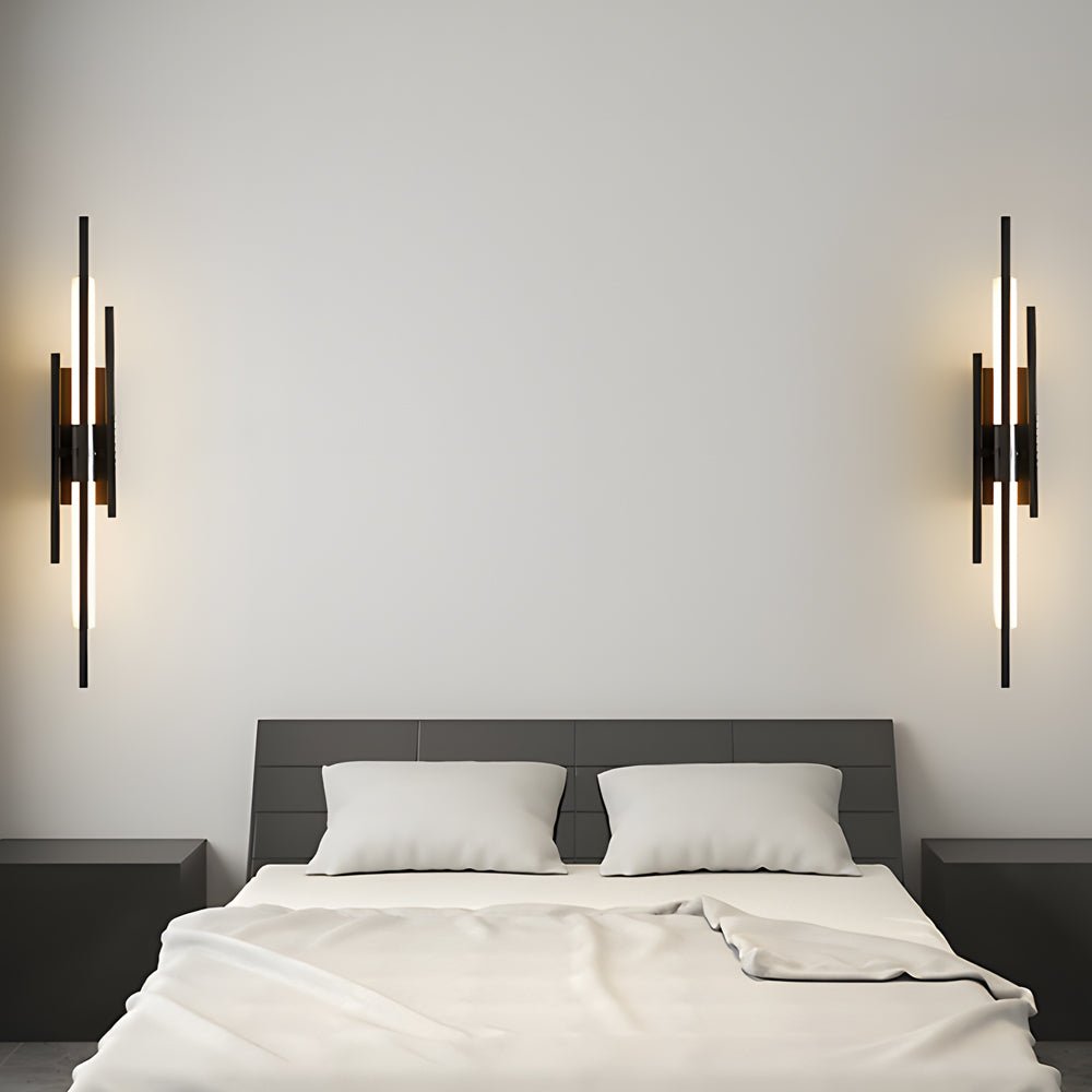 1. **WILLOUGHBY TRIO-TONE ACRYLIC WALL SCONCE**  
   A striking fusion of black, gold, and copper finishes, this modern LED wall sconce adds a contemporary flair to any space.

2. **CAVENDISH MODERNIST IRON WALL LANTERN**  
   Crafted from durable iron wi