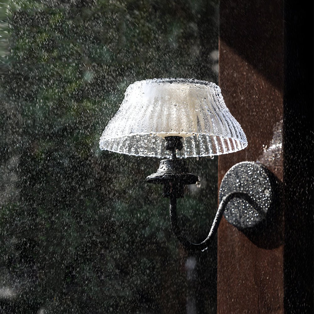 RAVENSDALE SOLAR-POWERED WALL LANTERN WITH CUSTOMIZABLE GLASS CANOPY