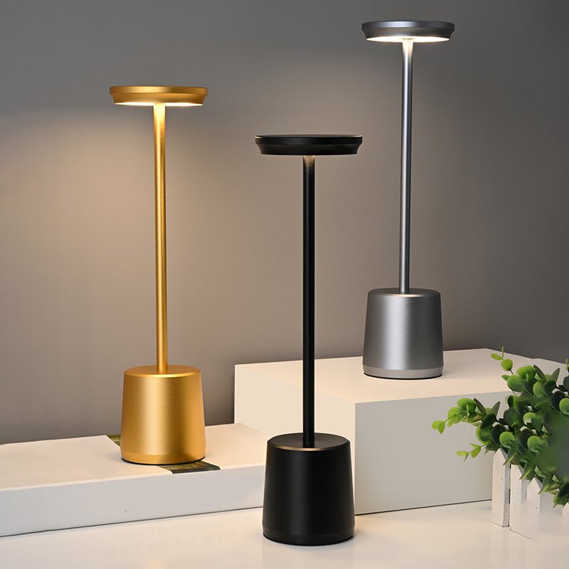 "WINTHORPE WIRELESS ILLUMINATION TABLE LAMP" 

This sophisticated lamp features a rechargeable LED design, providing versatile ambient lighting without the constraints of cords. Its modern aesthetic is perfect for any setting, seamlessly blending function