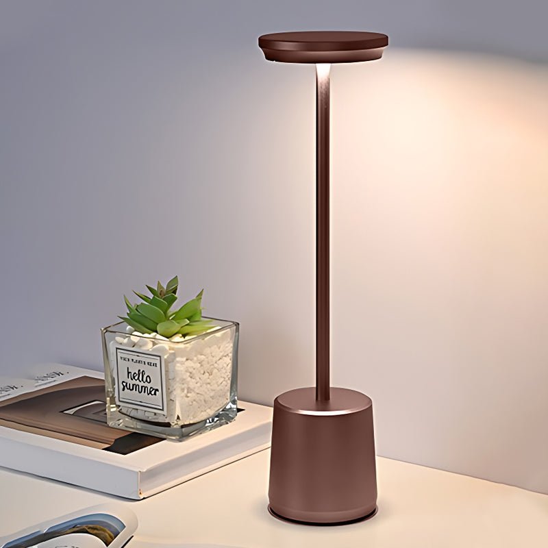 "WINTHORPE WIRELESS ILLUMINATION TABLE LAMP" 

This sophisticated lamp features a rechargeable LED design, providing versatile ambient lighting without the constraints of cords. Its modern aesthetic is perfect for any setting, seamlessly blending function