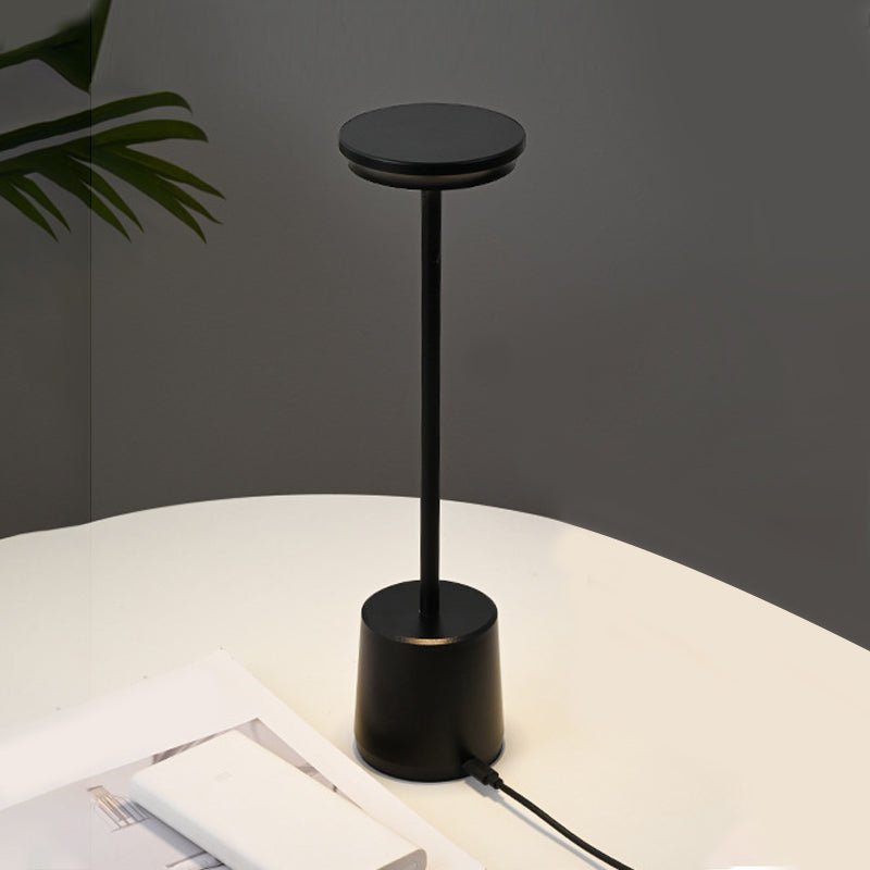 "WINTHORPE WIRELESS ILLUMINATION TABLE LAMP" 

This sophisticated lamp features a rechargeable LED design, providing versatile ambient lighting without the constraints of cords. Its modern aesthetic is perfect for any setting, seamlessly blending function