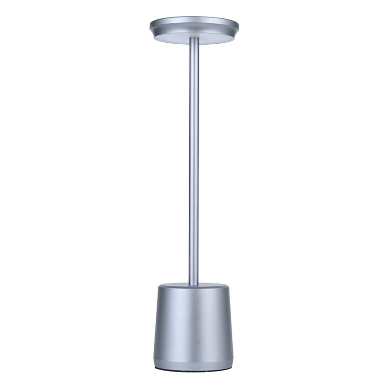 "WINTHORPE WIRELESS ILLUMINATION TABLE LAMP" 

This sophisticated lamp features a rechargeable LED design, providing versatile ambient lighting without the constraints of cords. Its modern aesthetic is perfect for any setting, seamlessly blending function