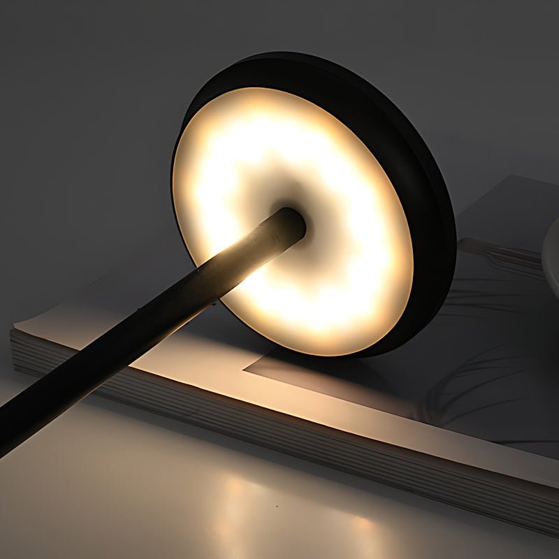 "WINTHORPE WIRELESS ILLUMINATION TABLE LAMP" 

This sophisticated lamp features a rechargeable LED design, providing versatile ambient lighting without the constraints of cords. Its modern aesthetic is perfect for any setting, seamlessly blending function
