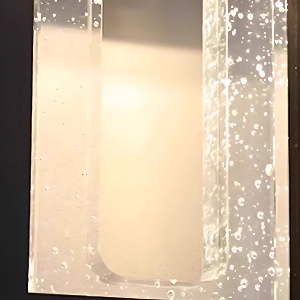 1. "WINDERMERE AQUA-BEAM OUTDOOR LANTERN"  
   - A waterproof fixture featuring a stunning crystal design that refracts light beautifully, perfect for illuminating garden paths and patios.

2. "HASTINGS CRYSTAL-CLAD WALL SCONCE"  
   - A weather-resistant