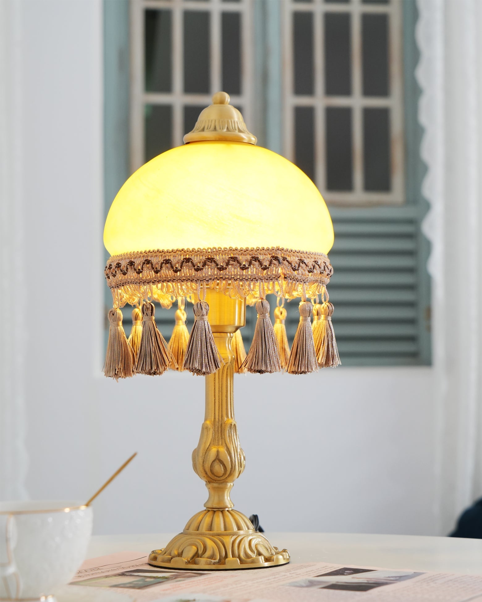 CHATEAU DORÉ BRASS TASSELED LAMP