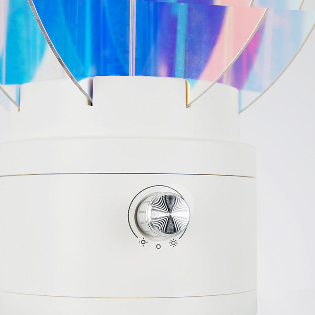 1. "VIVIENNE RAINBOW METAL TABLE LAMP"  
   A vibrant blend of colors and artistic design, this aluminum table lamp radiates warmth and creativity with its unique LED illumination.

2. "HAMPSTEAD ARTISANAL RAINBOW LAMP"  
   A striking fusion of color and