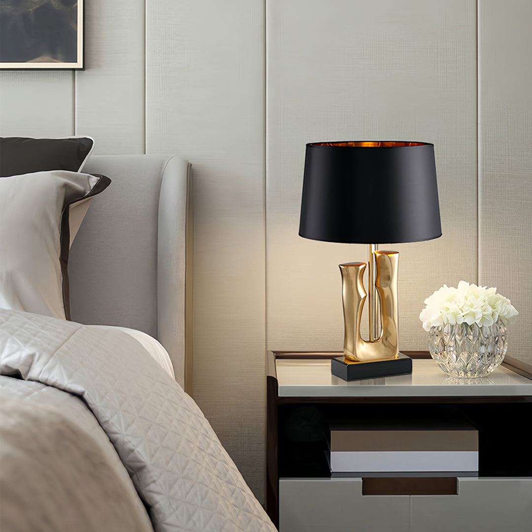 RAVENWOOD GOLDEN HORIZON TABLE LANTERN WITH SCULPTED BASE AND DRUM SHADE
