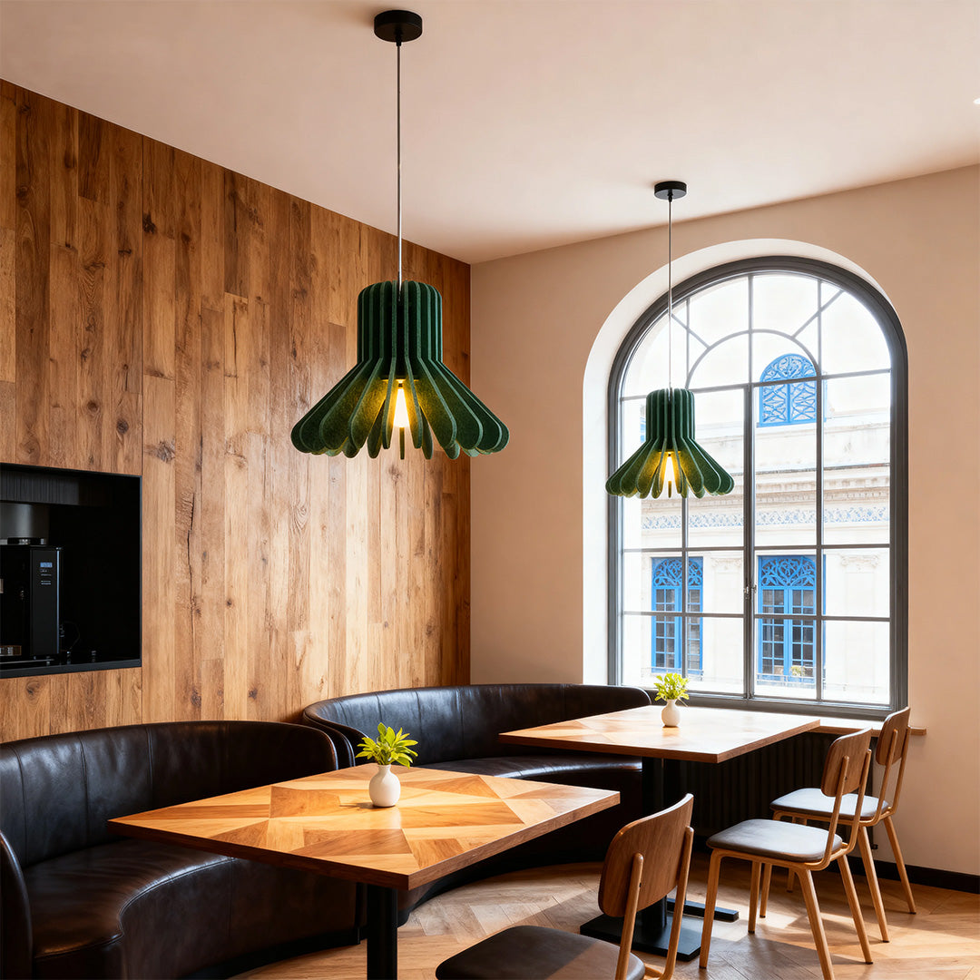 1. **MONTGOMERY FELT-ENCLOSED PENDANT LUMINAIRE**  
   A sophisticated pendant light featuring a sound-absorbing felt exterior and a robust iron frame, perfect for enhancing ambiance in any room.

2. **WINSLOW IRON & FELT HANGING ILLUMINATOR**  
   An inn