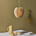 **FENWICK WOODEN RAY PENDANT LANTERN**  
A captivating blend of Scandinavian and Japanese design, this handcrafted wood veneer lantern features an LED light source, casting warm, inviting rays that enhance any space with a touch of nature-inspired charm.