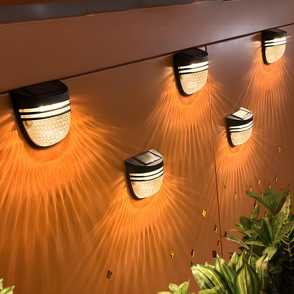 Hawthorne Solar-Infused Noir Lanterns, Set of Four"  
2. "Wellington Nightfall Solar Wall Illuminaries, Quad Set"  
3. "Chesterfield Solar-Ember Wall Fixtures, Pack of Four"  
4. "Carmichael Solar-Illuminated Ebony Fence Sconces, Four-Pack