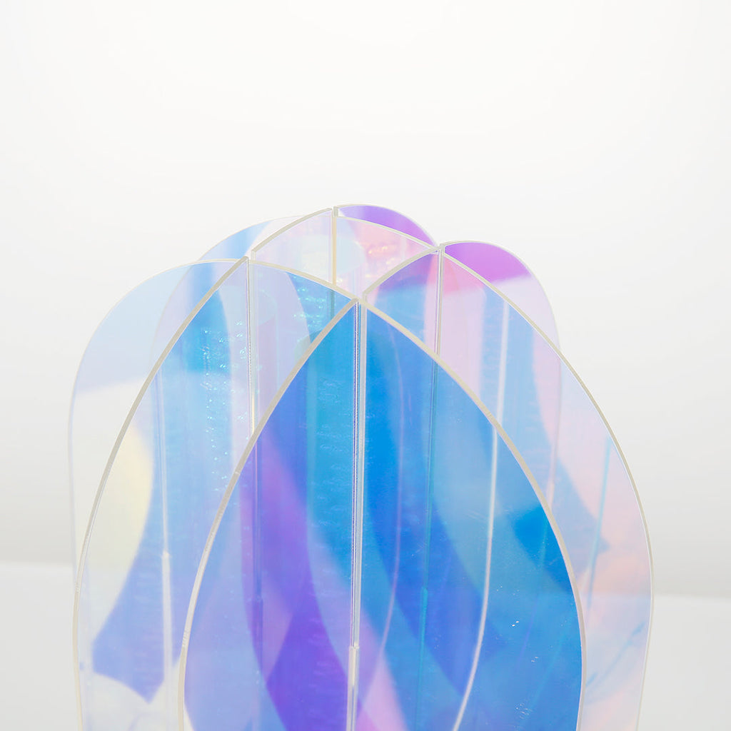 1. "VIVIENNE RAINBOW METAL TABLE LAMP"  
   A vibrant blend of colors and artistic design, this aluminum table lamp radiates warmth and creativity with its unique LED illumination.

2. "HAMPSTEAD ARTISANAL RAINBOW LAMP"  
   A striking fusion of color and