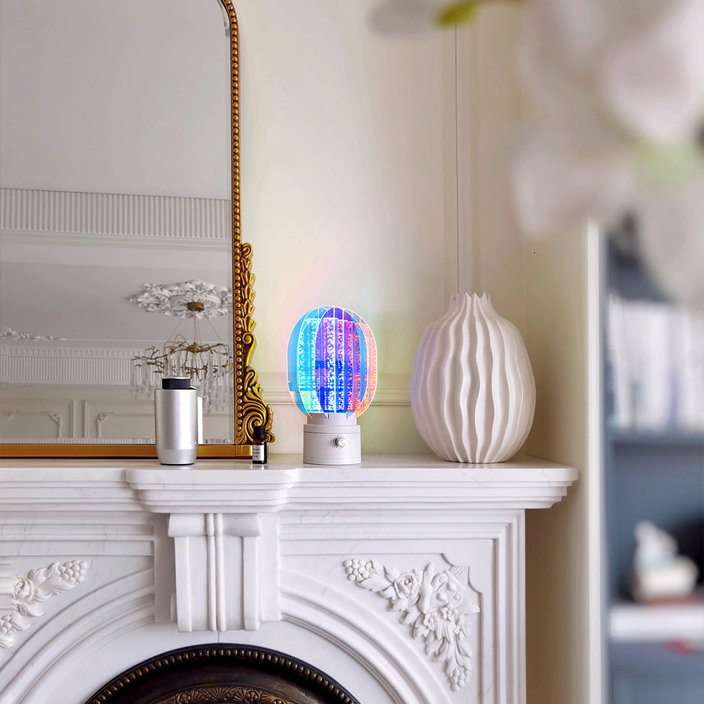 1. "VIVIENNE RAINBOW METAL TABLE LAMP"  
   A vibrant blend of colors and artistic design, this aluminum table lamp radiates warmth and creativity with its unique LED illumination.

2. "HAMPSTEAD ARTISANAL RAINBOW LAMP"  
   A striking fusion of color and