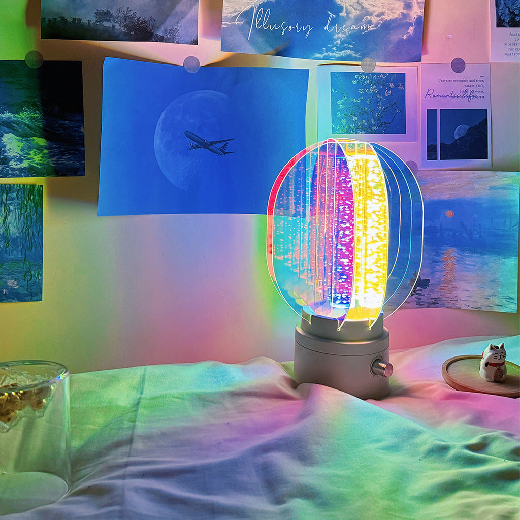1. "VIVIENNE RAINBOW METAL TABLE LAMP"  
   A vibrant blend of colors and artistic design, this aluminum table lamp radiates warmth and creativity with its unique LED illumination.

2. "HAMPSTEAD ARTISANAL RAINBOW LAMP"  
   A striking fusion of color and